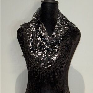 Chic Black and White Floral Lace Scarf it is in a triangle